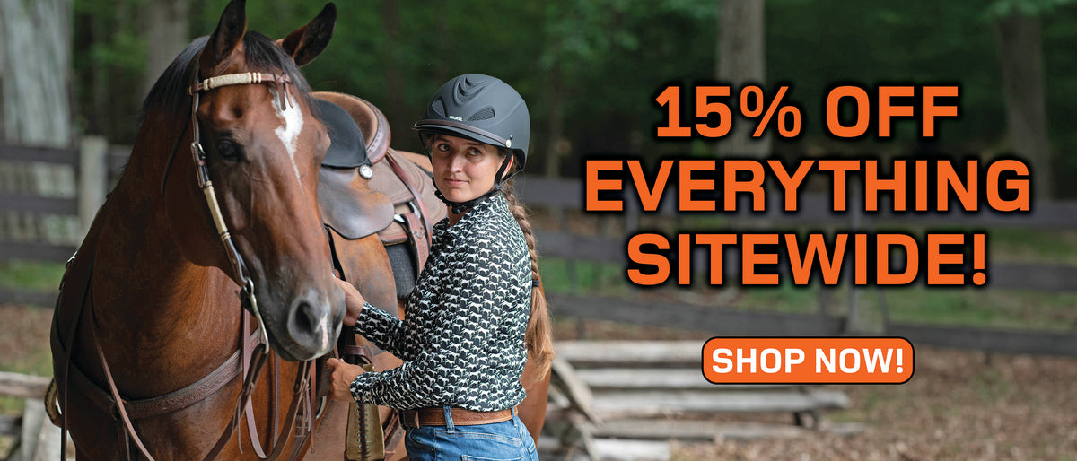 Woman wearing a Troxel riding helmet beside a saddled horse with text promoting 15% off everything sitewide.